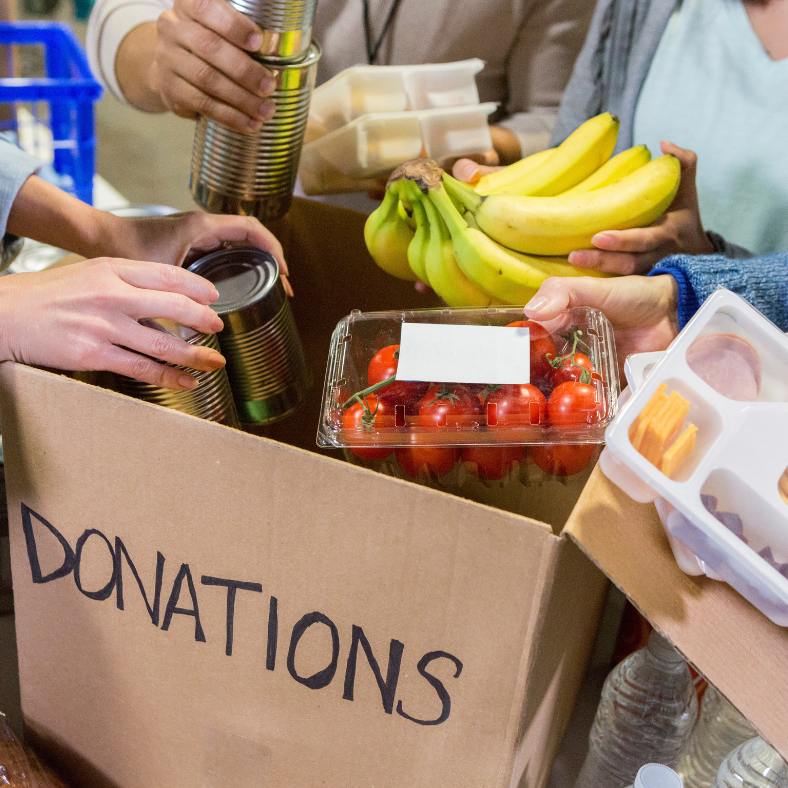 A box of food donations with the word donations on it