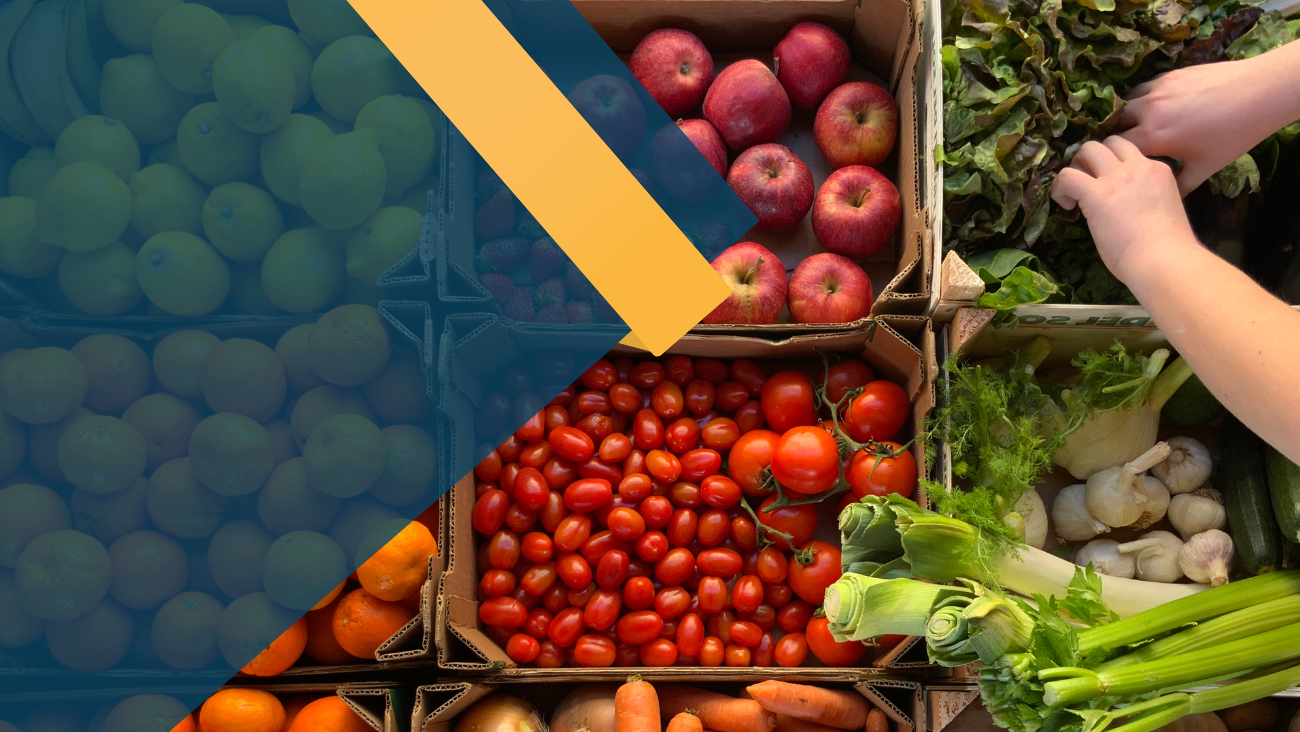 An array of fruit and vegetables in crates.